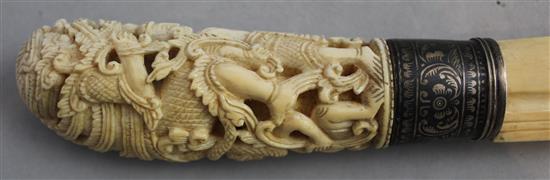 An early 20th century Indonesian ivory and silver mounted paperknife, 16.5in.